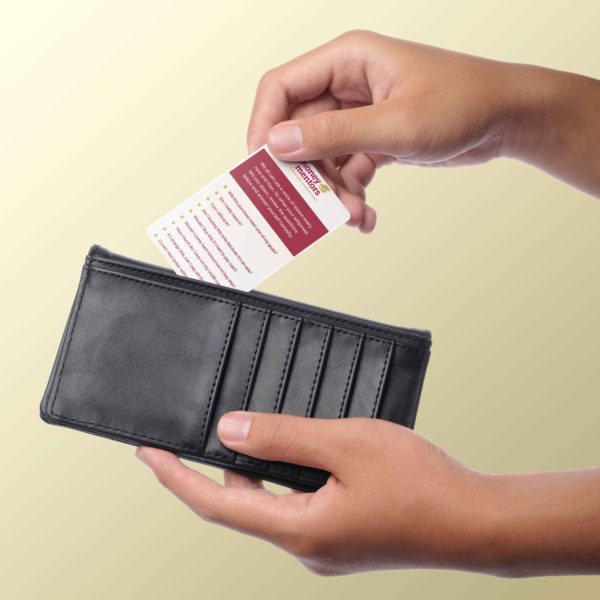 Someone inserts the Money Mentors wallet card into their wallet. 