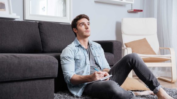 Man in his twenties thinks about his debt repayment options