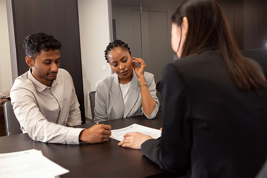 A couple look at the terms of their personal loan. 