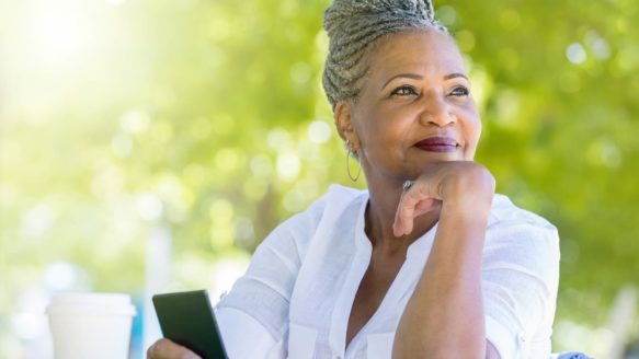 A woman in her sixties is optimistic about her first credit counselling appointment